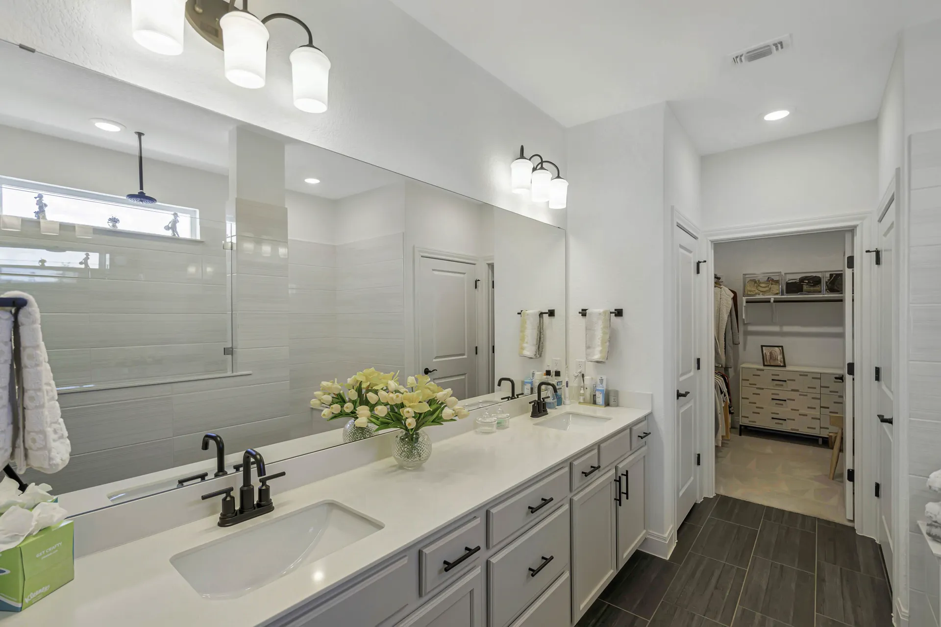 Primary walk-in shower with modern tile and glass enclosure