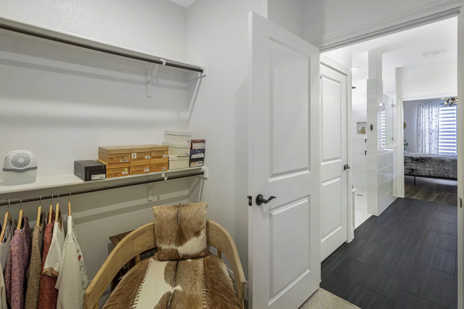 Primary closet — additional hanging and drawer storage